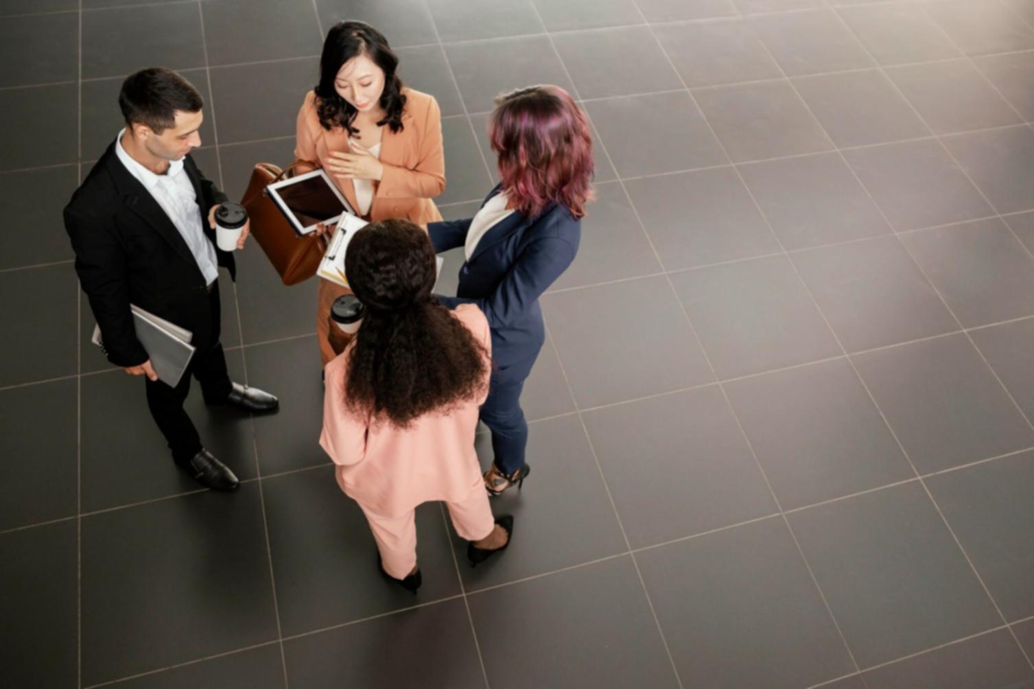 Business partnership meeting showing collaborative SEO audit process and strategic planning session with whiteboards and analysis documents